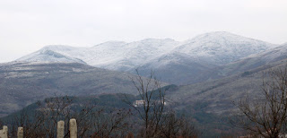 Snow on the peaks across the valley