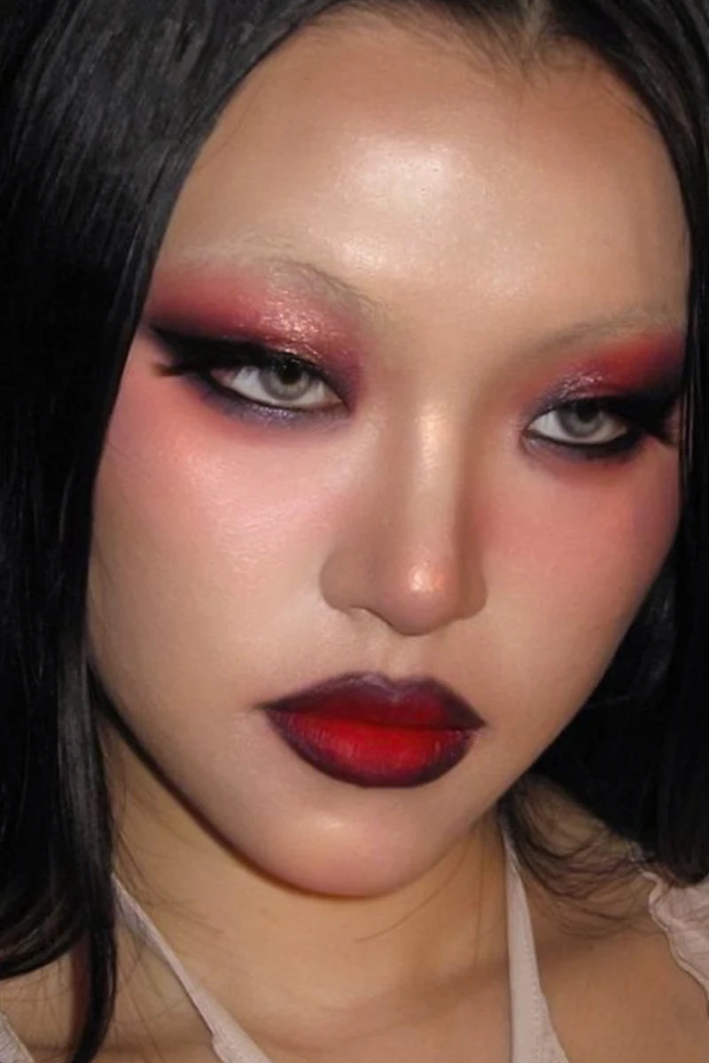 close-up selfie of a beautiful woman with reg goth makeup look