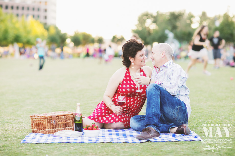 Couple at the park having a picnic celebrating their 4th Anniversary