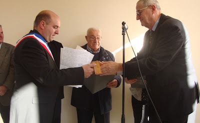 Current mayor of Ceyroux, Ludovic Daquet,  accepting the medal for his grandfather, Leon Daquet  Mr. Simonnet against the wall receiving medal