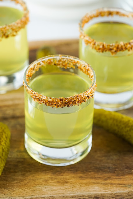 Pickle Juice Shots with Tajin seasoning on the rim.