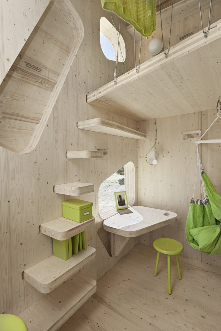Small wooden stairs in Student Flat by Tengbom architects