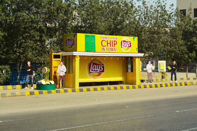 News Lays Chip in Town Messi & Akram Outdoor Campaign - Core Media 