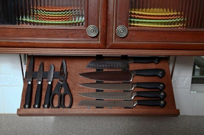 knife storage that installs under a kitchen cabinet; magnets hold the knives in place