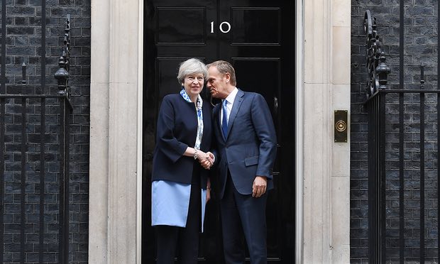 May and Tusk agree to 'lower tensions'