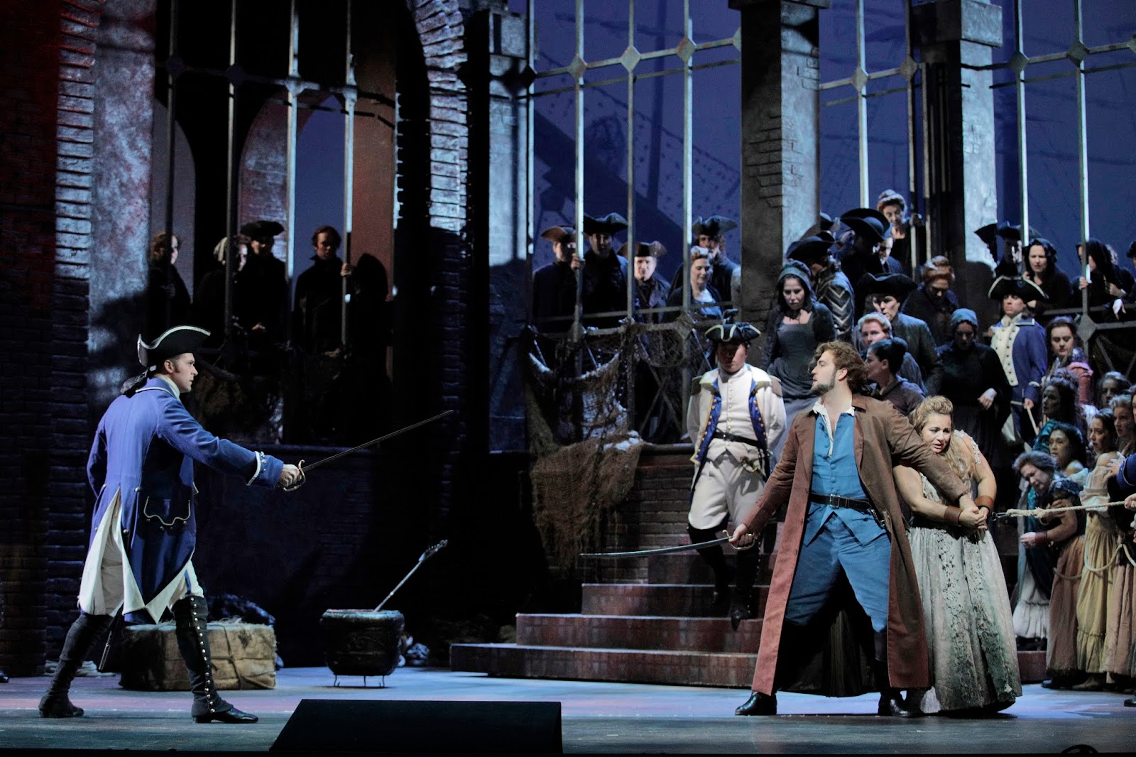 IN REVIEW: (from left to right) bass-baritone CHRISTIAN PURSELL as Il sergente degli arceri, tenor BRIAN JAGDE as Chevalier des Grieux, and soprano LIANNA HAROUTOUNIAN as Manon Lescaut in San Francisco Opera's November 2019 production of Giacomo Puccini's MANON LESCAUT [Photograph by Cory Weaver, © by San Francisco Opera]