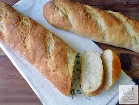 Vietnamese Baguette on the cutting board with a couple of slices cut and ready to eat