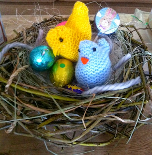 diy bird nest filled with chocolate eggs and crocheted chicks