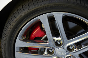 Red painted brake calipers are part of the SX Limited Package on the 2013 Kia Optima SX