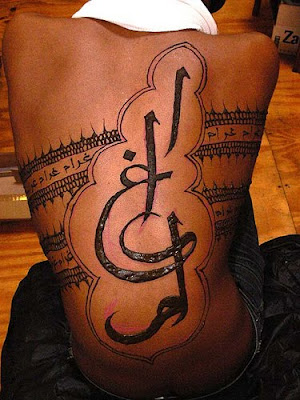 ARABIC TATTOO LETTERING on back body. Posted by tattoo designs