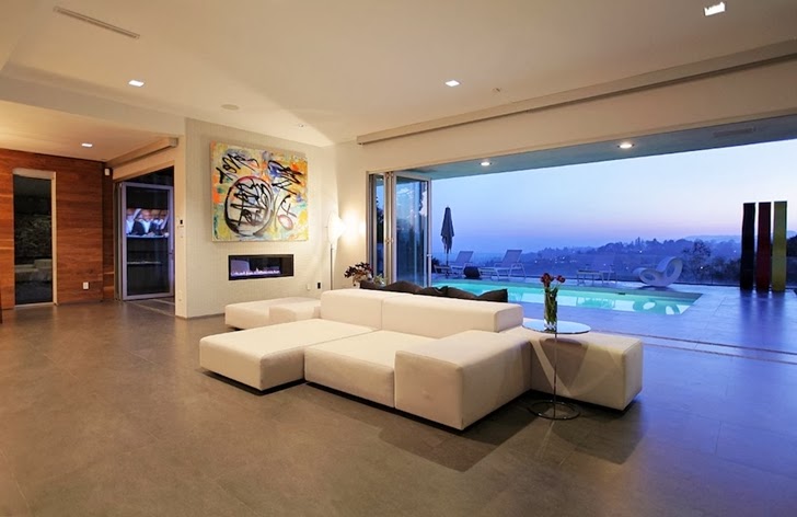 Living room furniture in Modern Beverly Hills House with open interiors