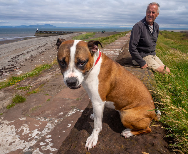 Photo of Ruby and Phil on the sea wall at Maryport