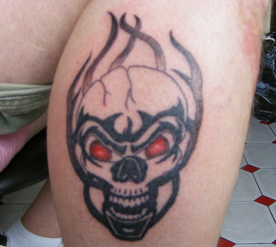 tribal flaming skull tattoos designs