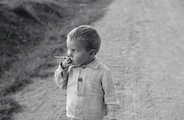 Young boy smoking on Russo-Finnish front, 25 August 1941 worldwartwo.filminspector.com