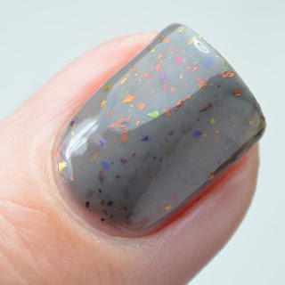 gray nail polish with color shifting flakies