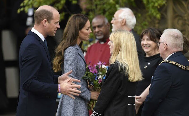 Kate Middleton wore a coat dress by Michael Kors. Vania Leles iconic Nile hoop earrings. Astley Clarke Stilla lapis pendant