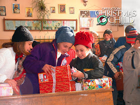 Operation Christmas Child girl with shoebox gift