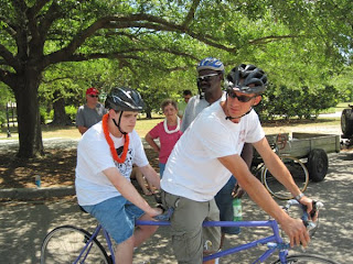 Taylor tandem biking with a sighted pilot