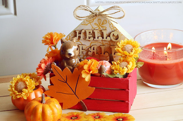 painted red wooden crate box with autumn decorations inside