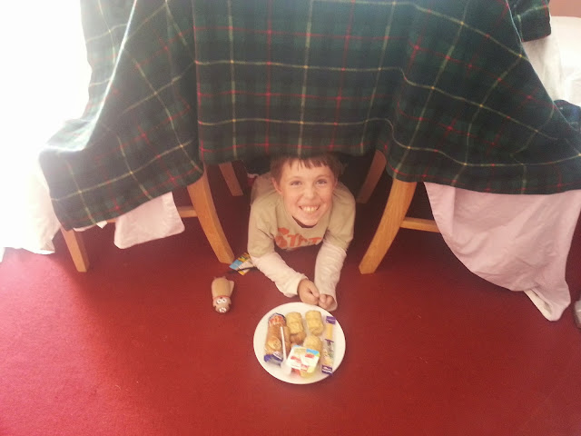 Boy in Homemade Den