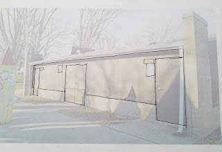 A lightened photograph of the side of a building, with black lines drawn on it to define the edges for a mural.