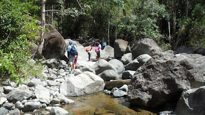 cross two shallow clear rivers and jumped over huge boulders