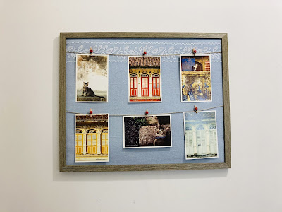 DIY photo hanging display with twinein a large frame