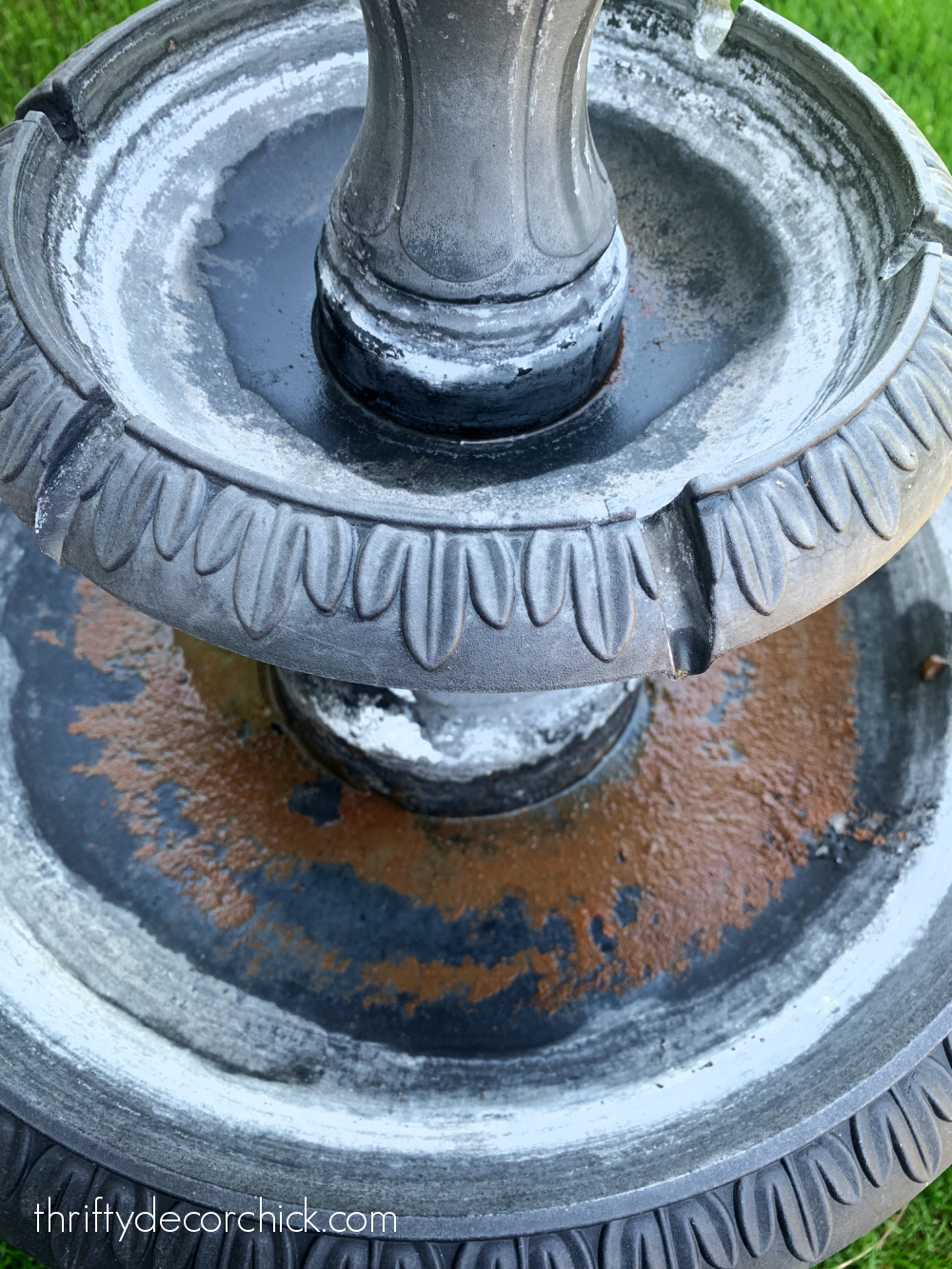 restoring dirty outdoor fountain
