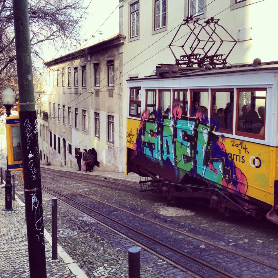 Ascensor da Gloria going down a hill in lisbon