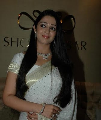 South actress Charmi in white Sari