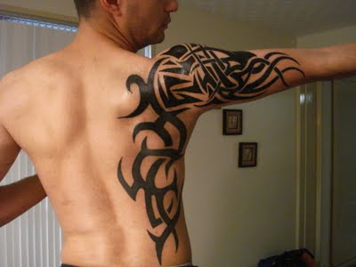 tribal tattoos on chest and arm tribal tattoos for men on chest First off