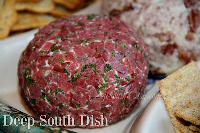 Cheeseballs make great party appetizers and the chipped beef version is exceptional. Made with dried beef, green onions, horseradish, Cajun seasoning, Worcestershire and parsley, then rolled in more dried beef and parsley.