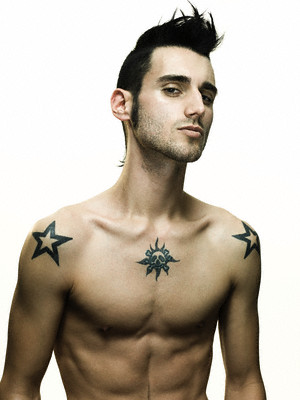 Handsome young male with two black framed tattoo on both shoulders