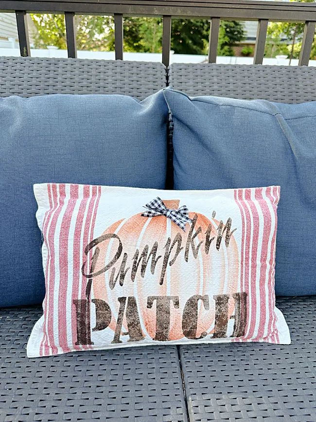 outdoor pillow on blue cushions