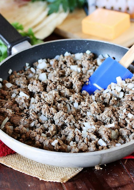 Making Filling for Cheesy Taco Tortilla Roll-Ups Image