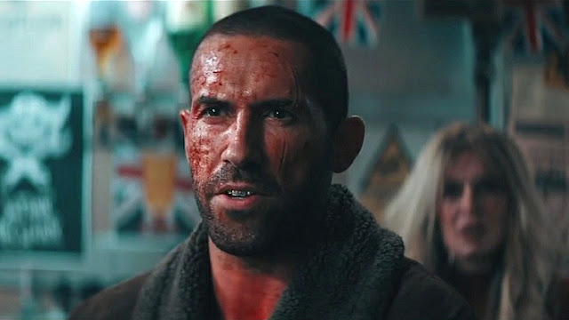 Scott Adkins covered in blood