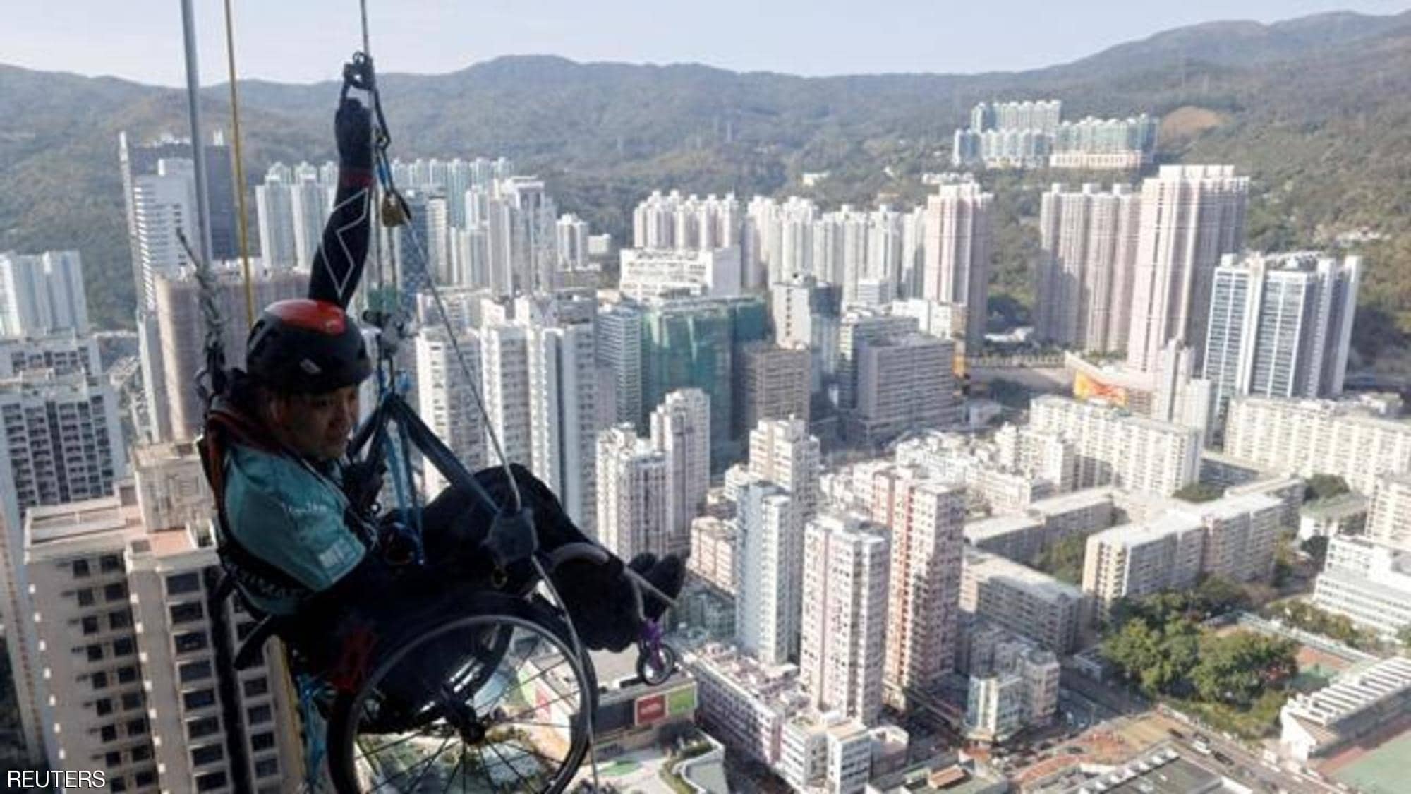 Lai Chi-wai ... climbs a wheelchair skyscraper