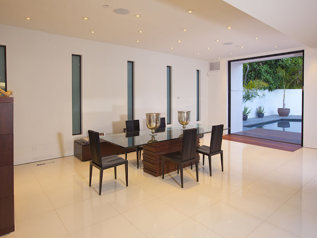 Photo of modern glassy dining table in the dining room
