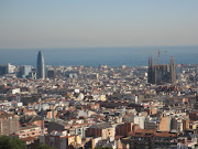 A view from a Barcelona park of two of the citys' more well known pieces of . (img )