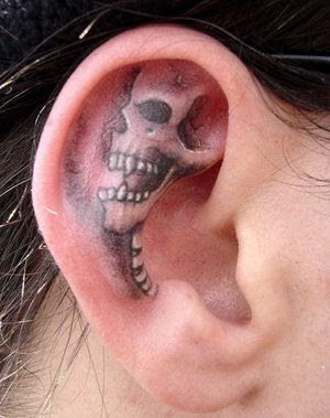 Skeleton designed tattoo in ear
