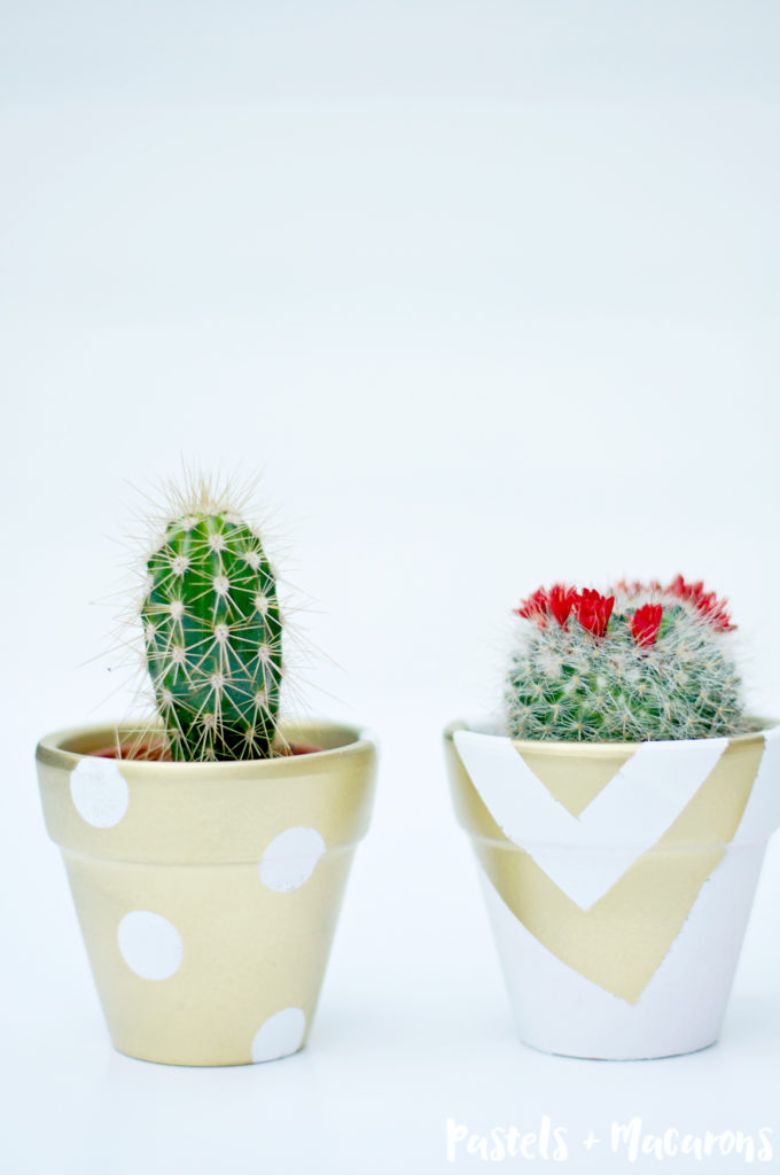 white and gold painted flower pots