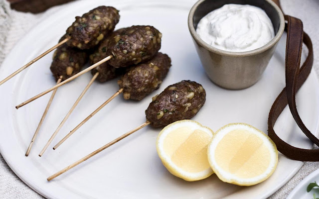 Lamb koftas with tahini sauce in a serving dish