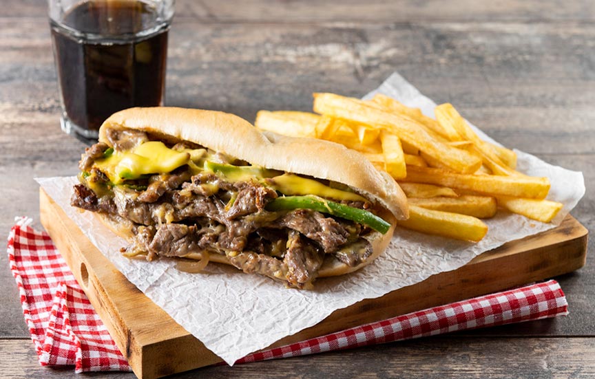 Cheesesteak with fries.