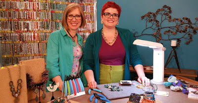 Katie Hacker and Ashley Bunting making Parachute Cord Bracelets.