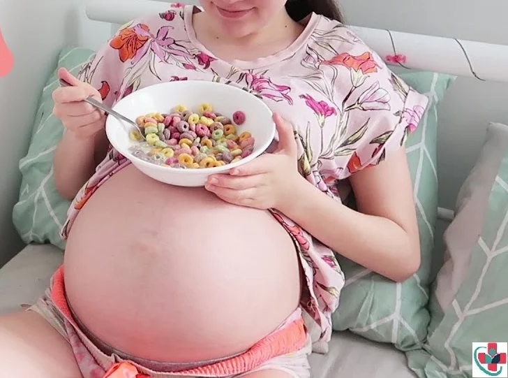 Pregnant woman eating