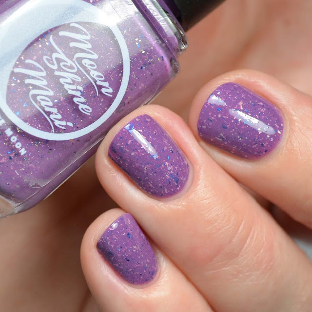 purple nail polish with flakies