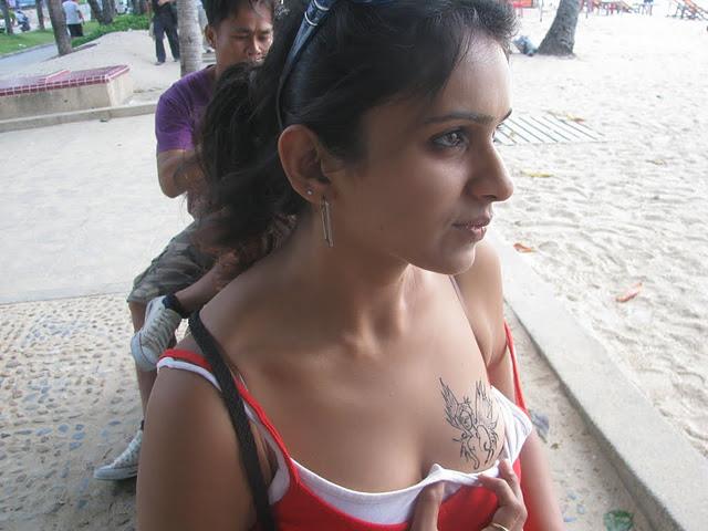 flower tattoo on a woman body side wearing a bikini