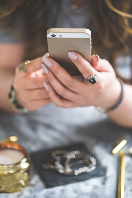 Woman checking social media on smartphone