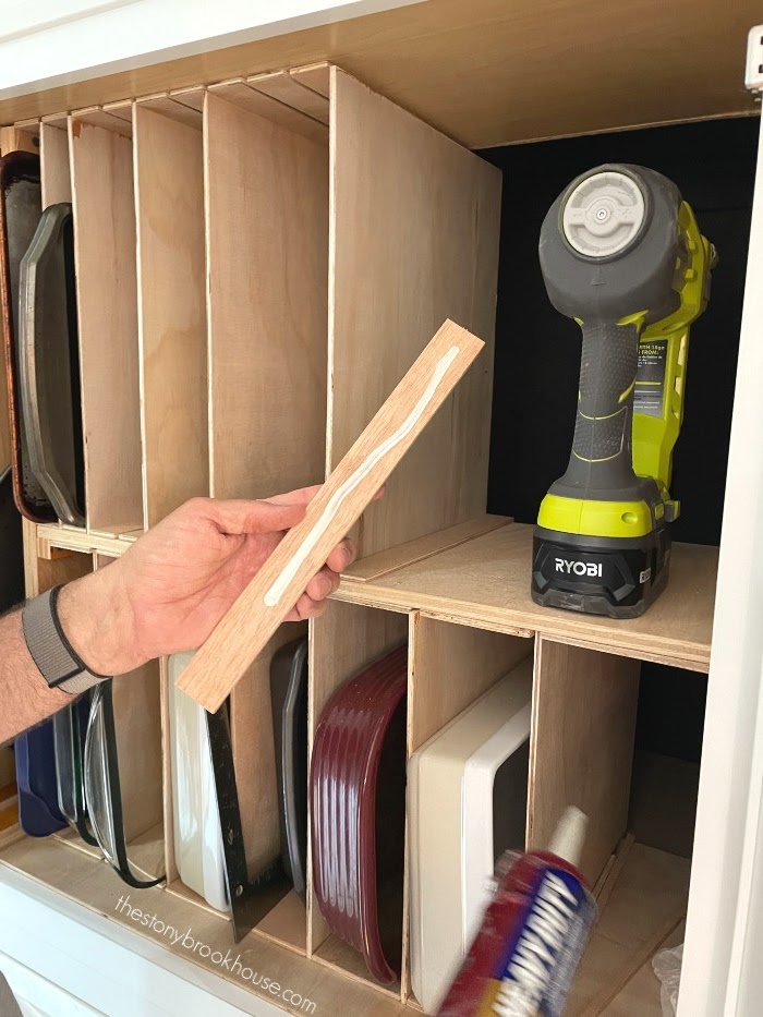 Adding glue to the spacer for the baking organizer