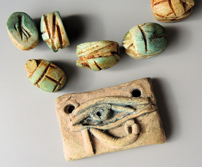 Eye of Horus focal by Scorched Earth, various scarabs.